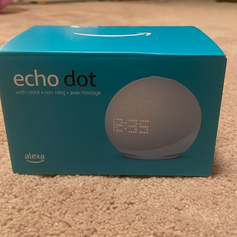 Echo Dot (5th Gen) with clock, power adapter.